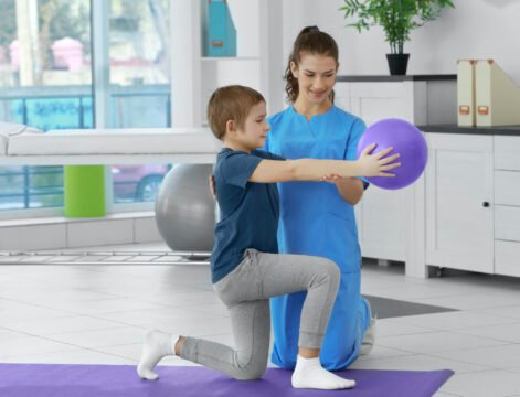 Physiotherapist working with patient in clinic