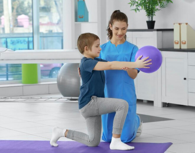 Physiotherapist working with patient in clinic